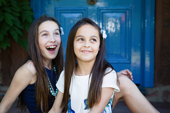 Young sisters laugh