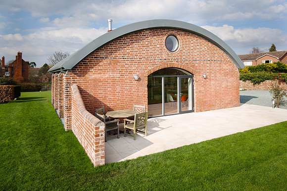 A curved shaped building shot from above